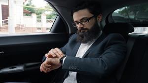 confident-businessman-sitting-car-back-sit (1) (1) Time Efficiency