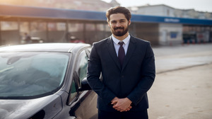 happy-cheerful-handsome-bearded-stylish-young-businessman-standing-his-car-after-washing-manual-car-washing-self-service-station-looking-camera (1) Exceptional Professionalism